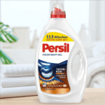 Persil Color Kraft-Gel laundry detergent bottle with red cap, shown on a light background.