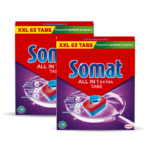 Two red boxes of Somat All in 1 Extra Tabs dishwasher tabs, overlapping with yellow advertising band at top reading XXL 63 TABS and green promo strip, brand name visible